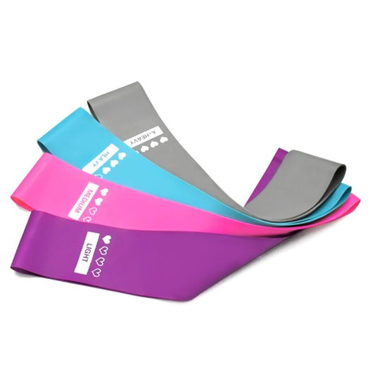 Set of resistance bands in purple, pink, and gray on a white background